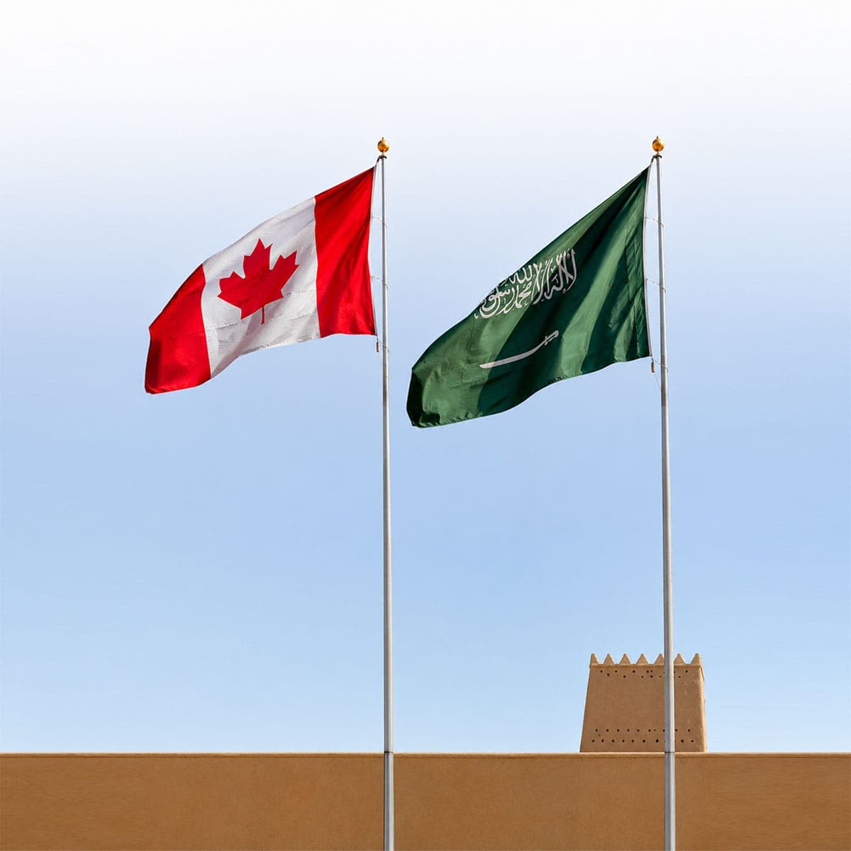Canadian and Saudi Arabian flags flying together